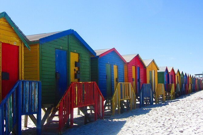 Cape Town Private Group Tour to Cape of Good Hope and Boulders Penguins Colony - Muizenberg provides a colorful finish