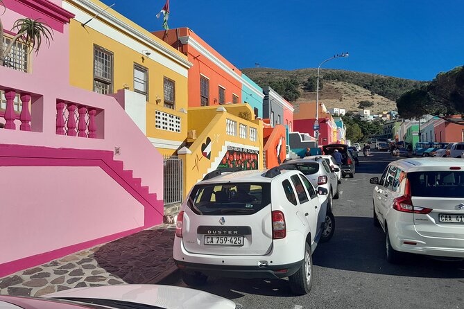 Penguins Boulders Beach and Cape Point Small Group Day Tour - Hout Bay, fishing boats, and a busy hour