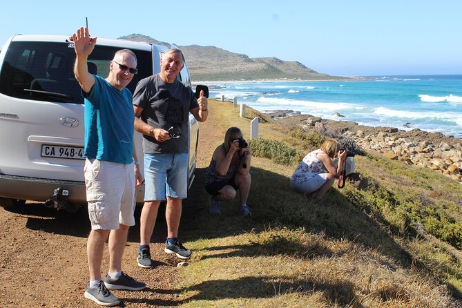 Private Tour from Cape Town To Cape of Good Hope Penguins Plus Wine Tasting F/D - Hout Bay, fishing boats, and optional Seal Island
